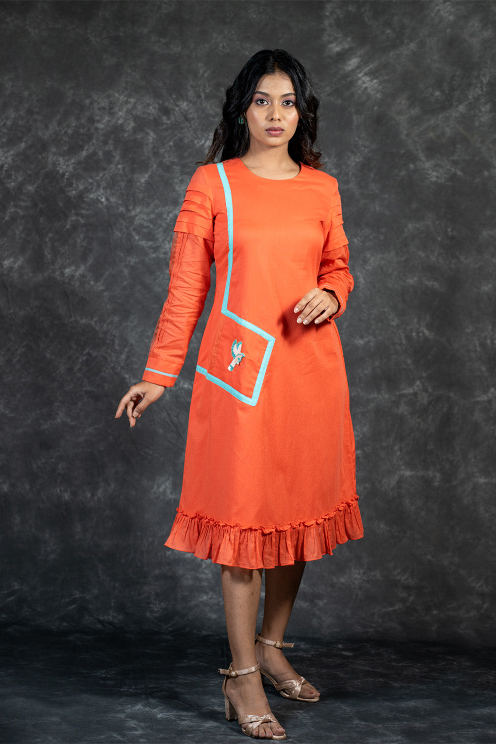 Orange mal dress with hand embroidered bird on pocket